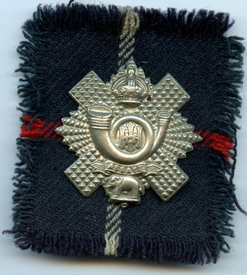WW1 Highland Light Infantry HLI Cap Badge with Tartan Backing